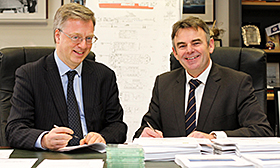 Cammell Laird Chief Executive John Syvret CBE and NERC Chief Operating Officer Paul Fox sign the contract in Birkenhead